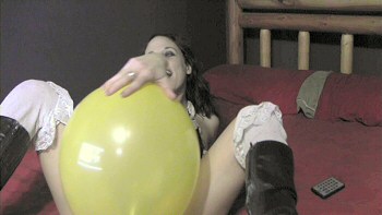 Jenn sits on balloon