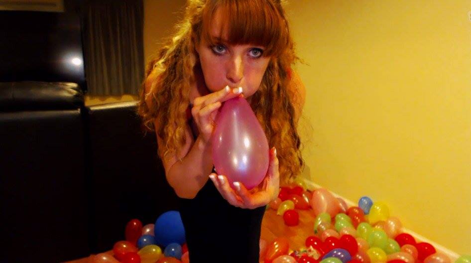 Kristy Russo blows up balloons
