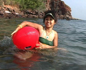 Joon Mali sits on inflatable whale